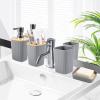 imageGrey Bathroom Accessories Sets Complete 9Piece Bathroom Accessories with Trash Can Vanity Tray Soap Dispenser Soap Dish Toothbrush Holder Toothbrush Cup Toilet Brush and Qtip HoldersHollow Grey